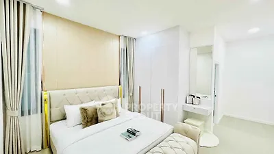 Luxurious modern bedroom with elegant decor and plush furnishings