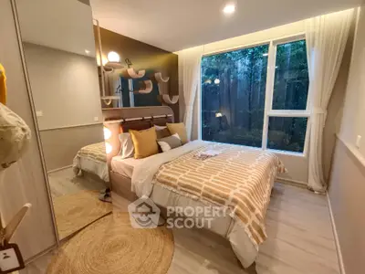 Cozy modern bedroom with large window and stylish decor