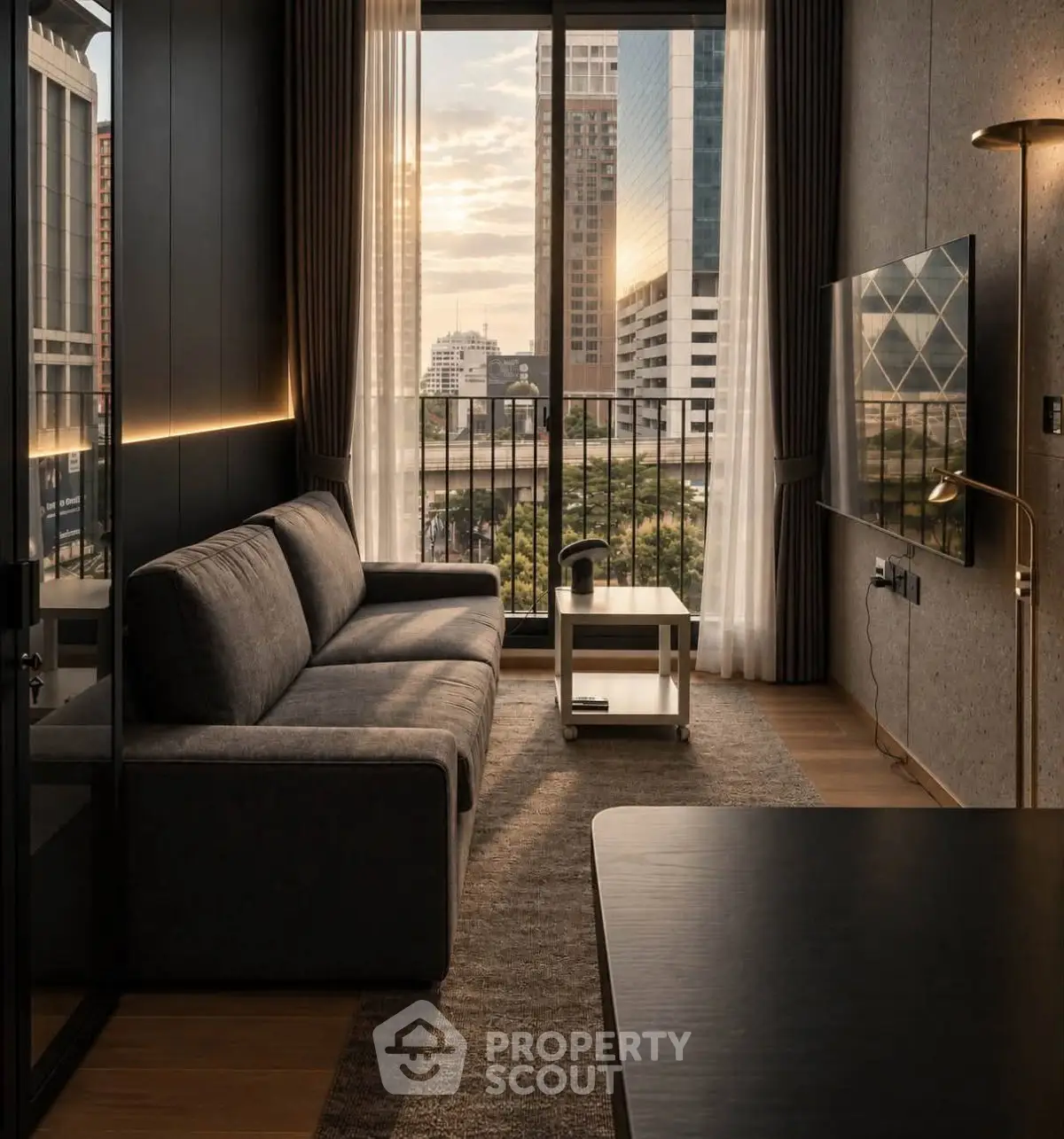 Modern living room with city view, sleek furniture, and floor-to-ceiling windows in urban apartment.
