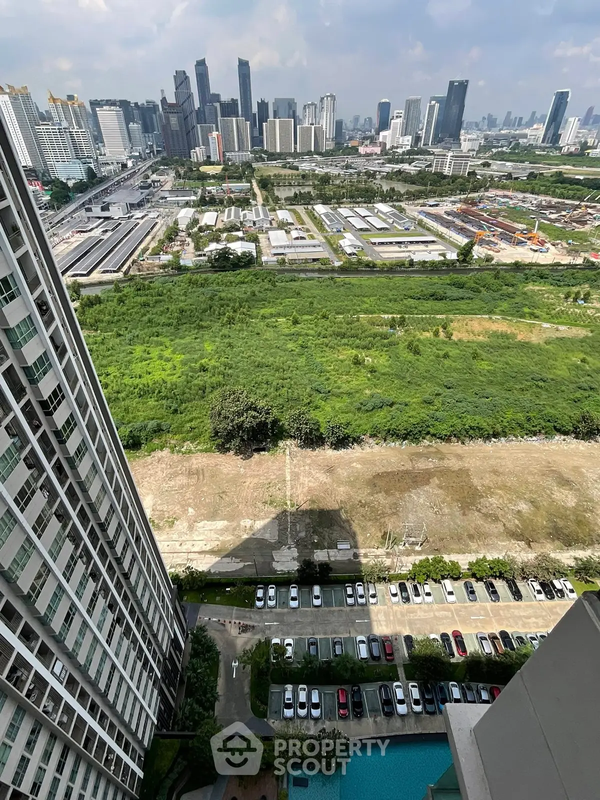 Stunning high-rise city view with lush greenery and urban skyline