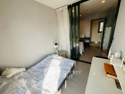 Cozy bedroom with sliding glass doors and modern decor