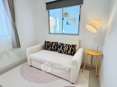 Cozy living room with stylish sofa and modern decor