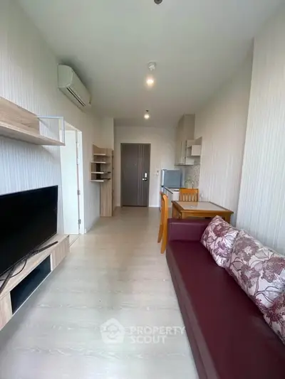 Modern living room with sleek furniture and open layout, perfect for urban living.