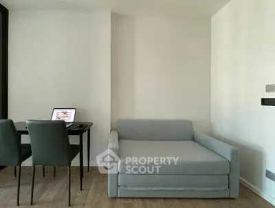 Modern minimalist living room with sleek furniture and neutral tones, perfect for urban living.