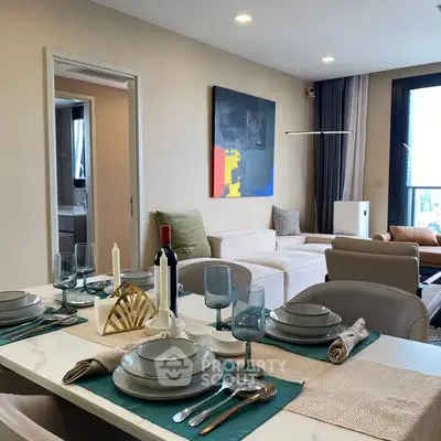 Modern living room with elegant dining setup and contemporary decor