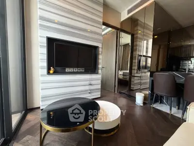 Modern living room with stylish decor and sleek furniture in a luxury apartment.