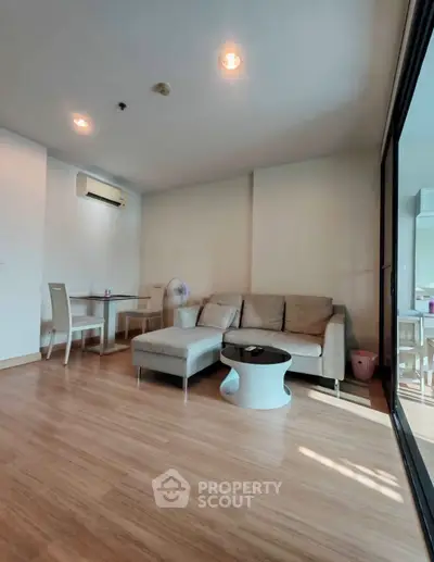 Spacious living room with modern furniture and natural light