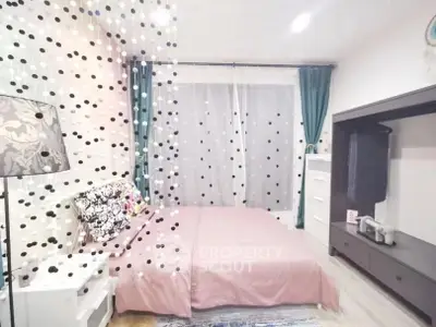 Charming bedroom with stylish decor and ample natural light, featuring a cozy bed and modern furnishings.