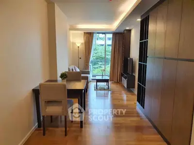 Modern living room with wooden floors and large window view