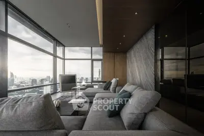 Luxurious modern living room with panoramic city views and elegant furnishings.