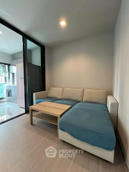 Modern living room with cozy sectional sofa and wooden coffee table