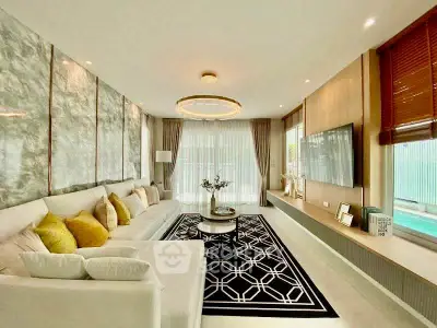 Luxurious living room with elegant decor, large sofa, and stylish lighting, perfect for modern living.