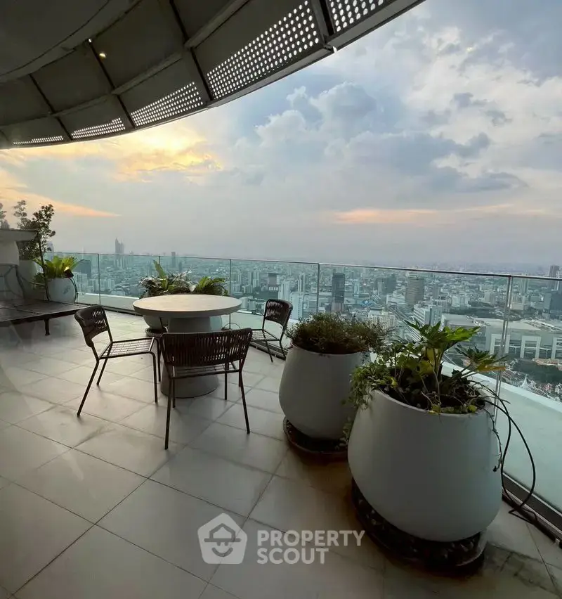 Stunning rooftop terrace with panoramic city views and modern outdoor seating.