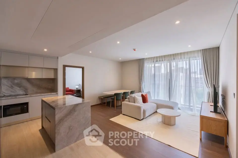 Spacious modern living room with open kitchen and elegant decor