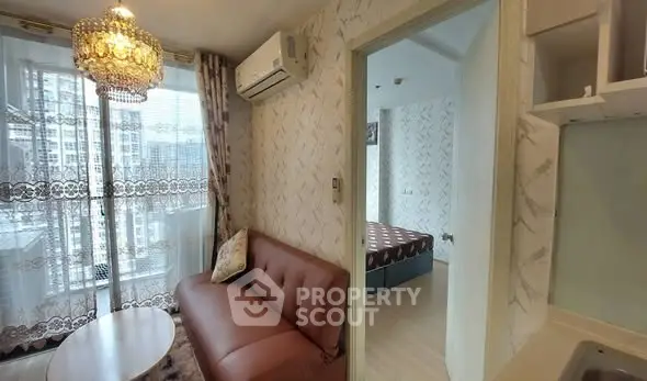 Modern apartment interior with cozy living room and bedroom view, featuring elegant decor and natural light.