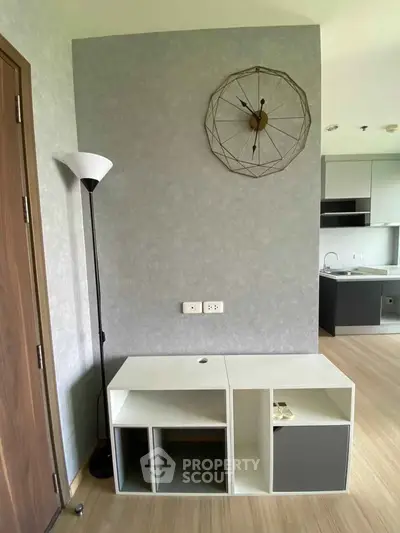 Modern living room with stylish clock and sleek furniture