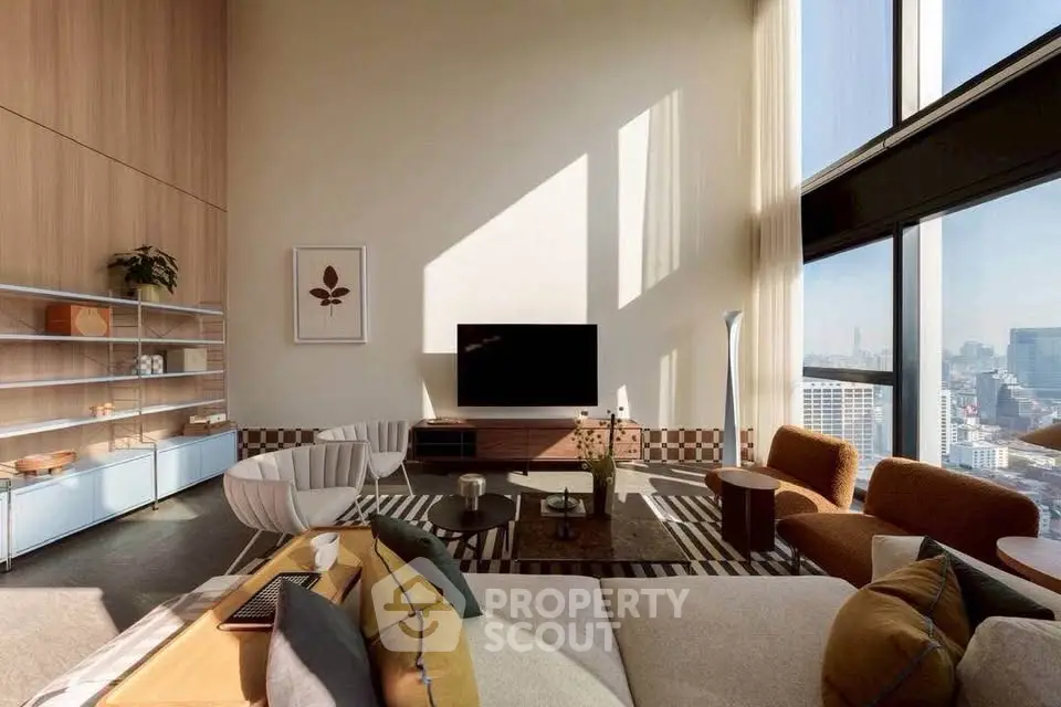 Luxurious high-ceiling living room with modern decor and stunning city view
