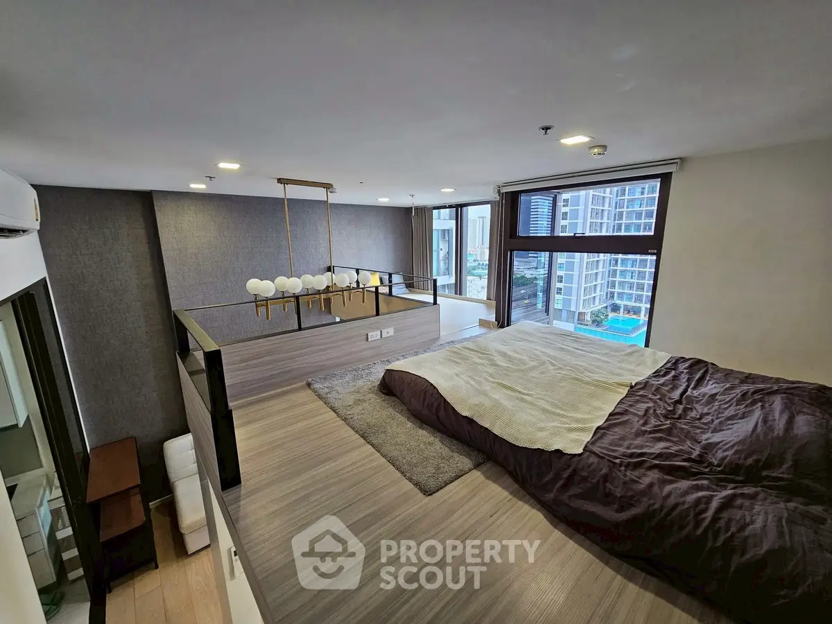 Modern loft bedroom with city view and stylish lighting
