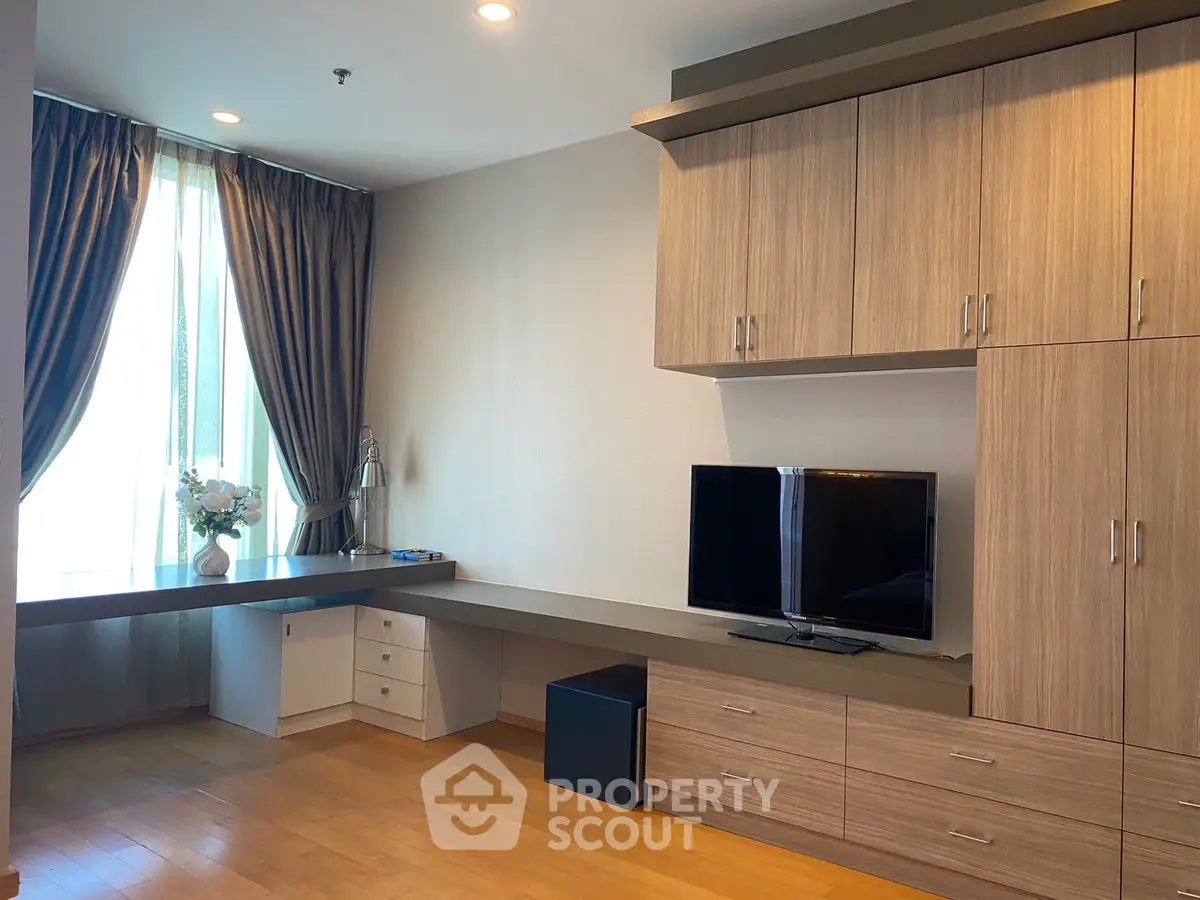 Spacious study room with modern wooden cabinetry and large window