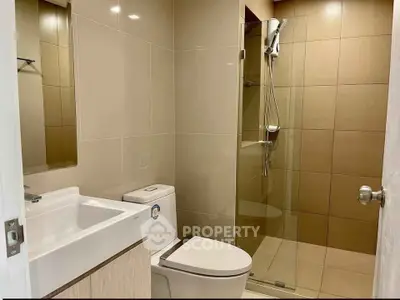 Modern bathroom with glass shower and sleek fixtures