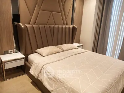 Luxurious bedroom with elegant headboard and modern decor, perfect for a restful retreat.