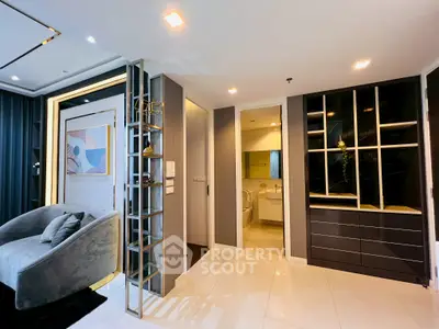 Modern living room with sleek design and adjacent bathroom