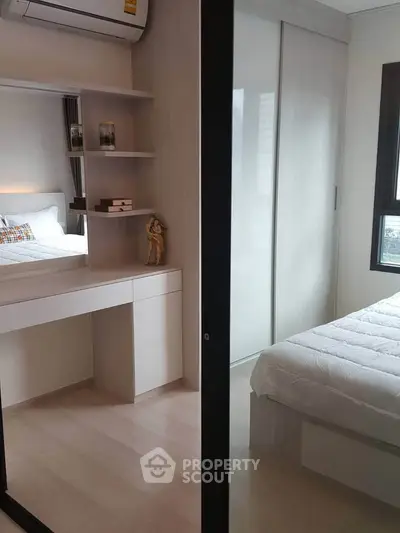 Modern bedroom with sleek design and ample natural light