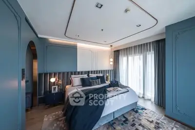 Luxurious modern bedroom with elegant blue decor and large windows