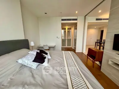 Spacious modern bedroom with elegant decor and natural light