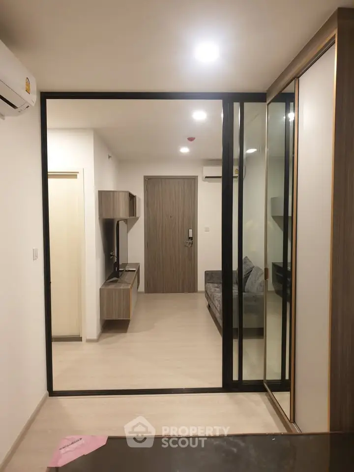 Modern apartment interior with sliding glass doors and stylish furniture