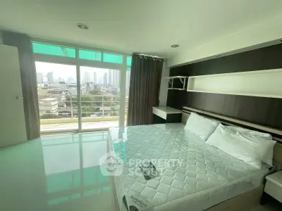 Spacious bedroom with city view and modern design in high-rise apartment