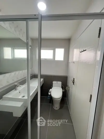 Modern bathroom with sleek design and glass shower enclosure