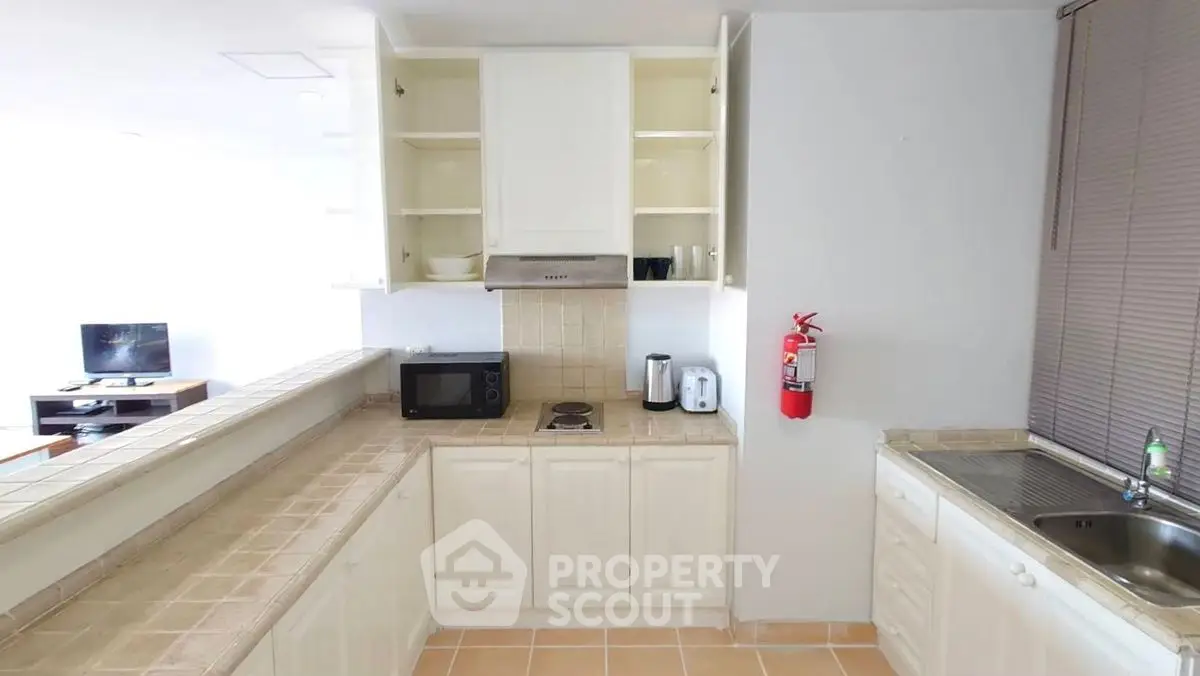 Spacious kitchen with open layout and modern appliances