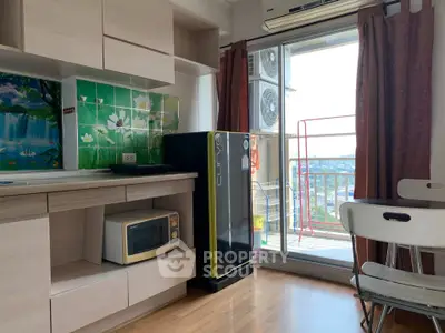 Charming kitchen with balcony view, featuring modern appliances and stylish decor.