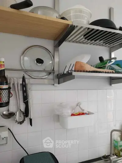 Modern kitchen with open shelving and organized utensils