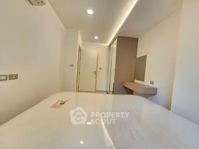 Modern minimalist bedroom with sleek design and built-in wardrobe