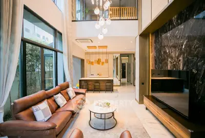 Luxurious modern living room with high ceilings and elegant decor