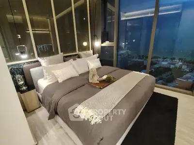 Luxurious modern bedroom with panoramic city view and elegant decor