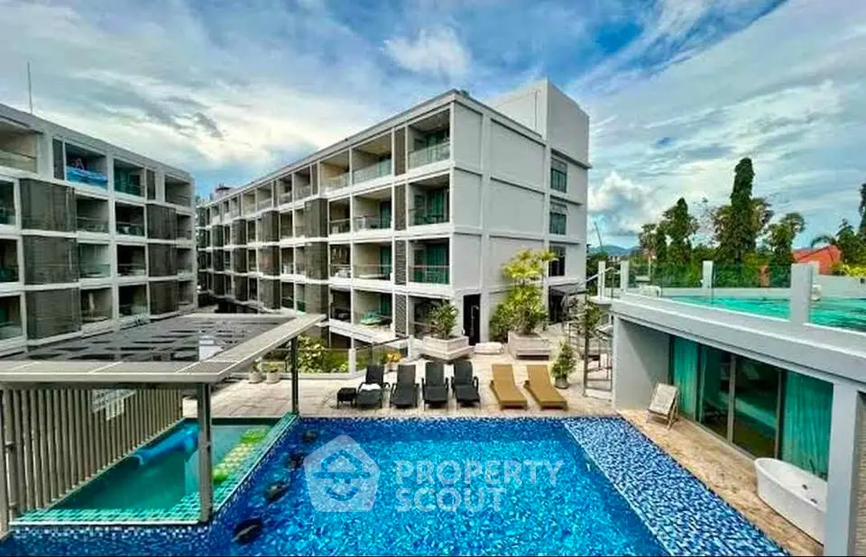 Luxurious modern apartment complex with stunning pool and spacious balconies.