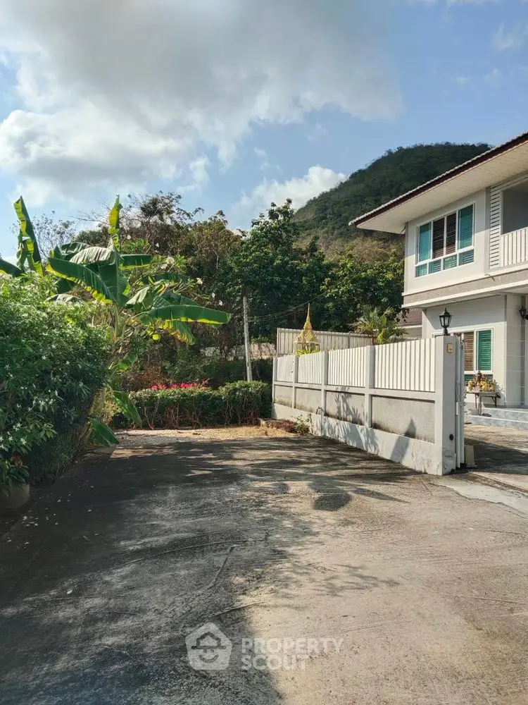 Charming two-story house with mountain view and lush garden