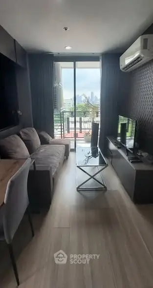 Modern living room with balcony view and sleek furniture