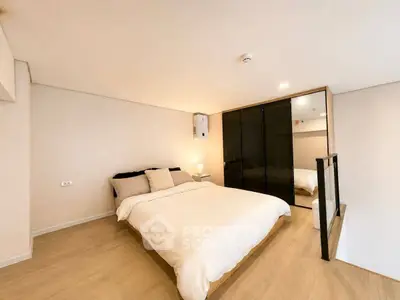 Modern bedroom with minimalist design and cozy ambiance