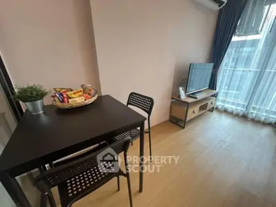 Modern living room with sleek furniture and large window for natural light