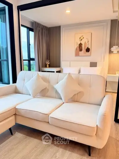 Modern living room with elegant white sofa and stylish decor