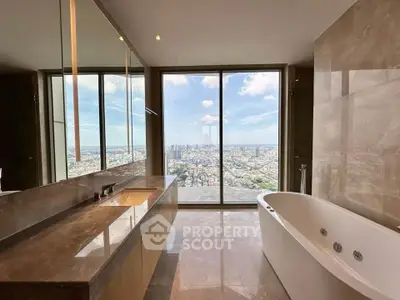 Luxurious bathroom with stunning city view from floor-to-ceiling windows, featuring a modern bathtub and elegant design.