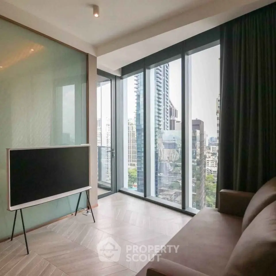 Modern living room with floor-to-ceiling windows and city view