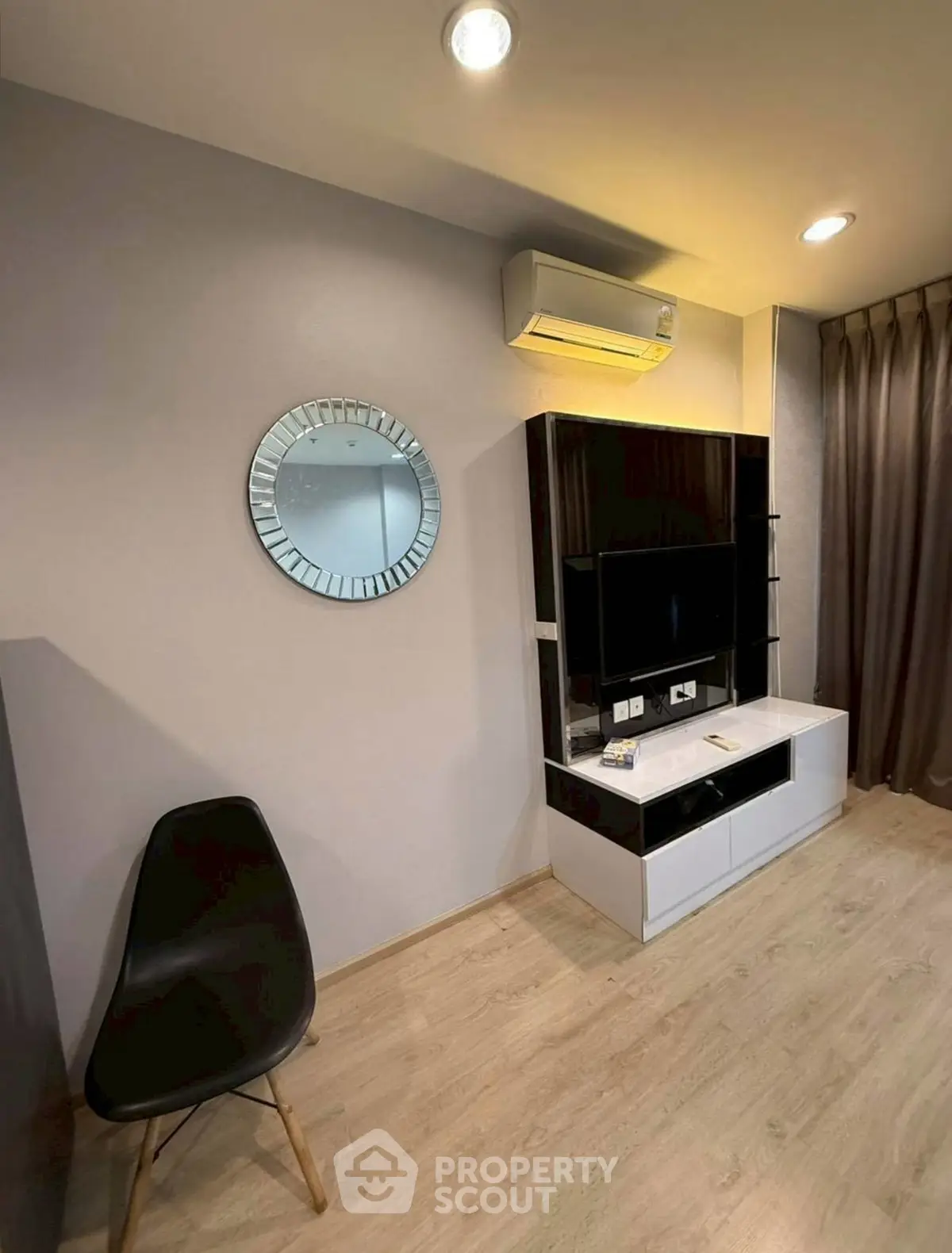 Modern living room with sleek TV unit and stylish decor