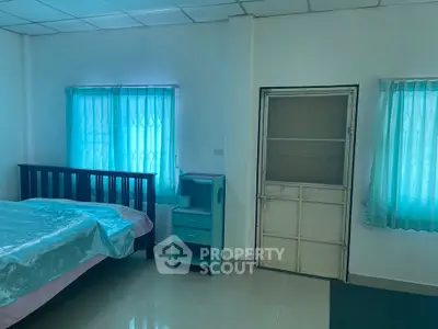 Cozy bedroom with natural light and minimalist decor
