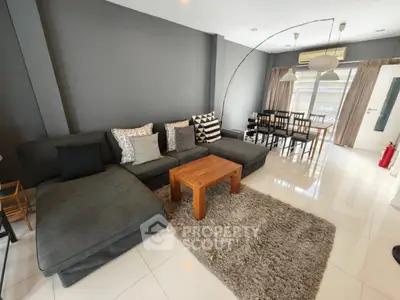 Spacious modern living room with stylish decor and ample natural light