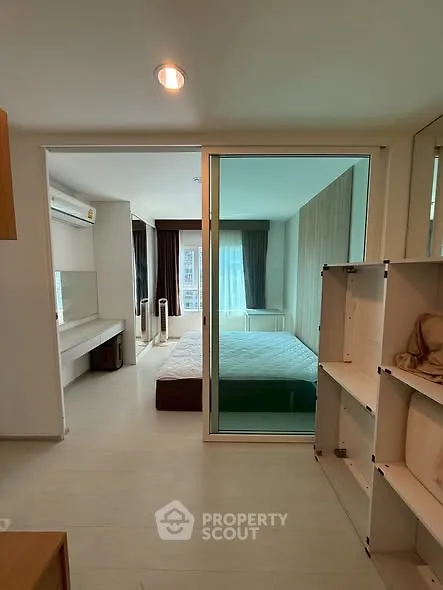 Modern bedroom with glass partition and stylish decor